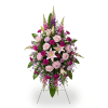 Tall standing floral spray with pink and purple flowers on a wire easel