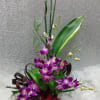 Tall bouquet with purple orchids and red roses