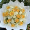 Bouquet of yellow and white roses with small daisy flowers wrapped in white paper