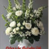 White floral arrangement in a pedestal vase