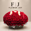 Basket arrangement of red and white roses