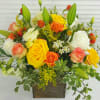 White and Yellow roses, snap, lilies, orange spray roses, solidago, waxflower, and