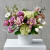 A breathtaking arrangement of premium spring blooms in a harmonious blend of