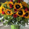 Sunflower and red rose arrangement in a green vase