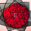 Bouquet of red roses wrapped in black paper