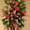Tall floral spray with red gerbera daisies and pink roses