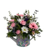A bright cluster of pink gerbera daisies and soft carnations makes this