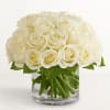 Bouquet of white roses in a clear glass vase