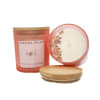 Two caramel pecan candles with wooden lids on a white background
