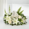 White floral sympathy arrangement with a memorial stone centerpiece