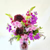 Select this fun arrangement of purple and lavender tones. Flowers include dahlias