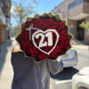 Bouquet of red roses with a white heart and "21" decoration