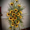 Tall sunflower arrangement with yellow blooms and mixed greenery