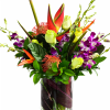Tropical bouquet with purple orchids and red-orange heliconia in a glass vase