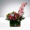 A sophisticated floral arrangement featuring premium pink lilies paired with a graceful