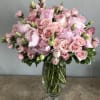 Pink rose bouquet in a clear glass vase