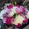 Bouquet of pink roses, white chrysanthemums, and purple filler flowers