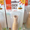 Packaged wooden duck call toy with Beetle & Bee Garden branding
