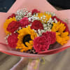 1 dozen carnations and 5 sunflowers wrapped in paper with baby&rsquo;s breath.