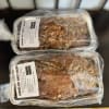 Two packaged loaves of banana nut sweet bread on a table