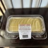 Carrot cake in a clear plastic clamshell container