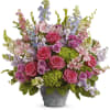 Mixed pink and lavender flowers in a gray pot