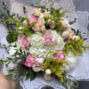 A beautiful bouquet of pink roses &amp; carnations with white hydrangeas 