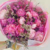 Full, blushing pink peonies take center stage in this whimsical peonies bouquet