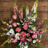 Pink and white mixed flower arrangement in a white vase