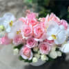 Clean and elegant design with soft pink roses and pure white orchids