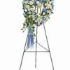 Blue and white floral standing spray on an easel