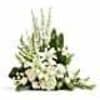 Tall white floral arrangement with dark green accents