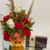 Cute small ceramic pot, yes chocolates are included 