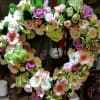 Heart-shaped floral wreath with pastel roses and gerbera daisies