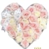 Heart-shaped bouquet of pale pink and white roses with a decorative ribbon