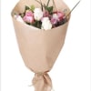 A beautiful mix of spring flowers hand tied and wrapped in craft