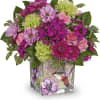 Pink and green mixed flower arrangement in a decorated glass vase