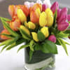 Colorful tulip bouquet in a clear glass vase