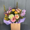 A fun and unique arrangement of spring flowers for Mother's day! 