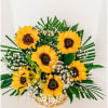 Basket arrangement of sunflowers with baby's breath and palm leaves