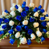 Bouquet of blue and white roses in a dense rounded arrangement