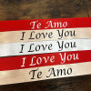 Stacked red and ivory ribbons printed with "Te Amo" and "I Love You"