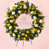Yellow and white floral wreath on a pink background