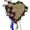 Heart-shaped floral standing spray with red roses and white blooms