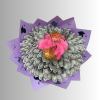 Bouquet of pink roses made with folded dollar bills and purple wrapping