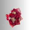Bouquet of red roses wrapped in red paper with butterfly decorations