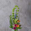 The McKenna arrangement reaches new heights of beauty. Hot pink Gerber's and