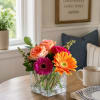 Celebrate life's little moments with this vibrant mix of roses and gerbera