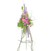 An beautiful pink easel spray including pink Roses and Willow with accents