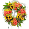 The colors of sunset are evident in this beautiful wreath including sunflowers